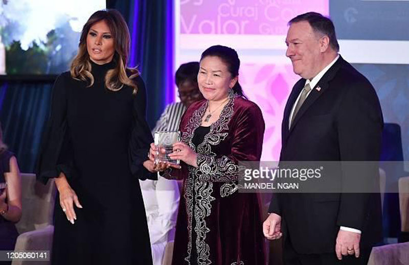 International Women of Courage (IWOC) Award recipient Sayragul Sauytbay of Kazakhstan poses with US Secretary of State Mike Pompeo (R) and First Lady Melania Trump at the State Department in Washington, DC on March 4, 2020. (Photo by MANDEL NGAN / AFP) (Photo by MANDEL NGAN/AFP via Getty Images) International Women of Courage (IWOC) Award recipient Sayragul Sauytbay of Kazakhstan poses with US Secretary of State Mike Pompeo (R) and First Lady Melania Trump at the State Department in Washington, DC on March 4, 2020. (Photo by MANDEL NGAN / AFP) (Photo by MANDEL NGAN/AFP via Getty Images)